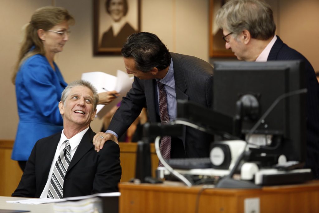 Steven Mark Chaney and Innocence Project Attorneys M. Chris Fabricant (center) and Barry Cshack (right) during a hearing in a Dallas courtroom where a court reversed his 1987 murder conviction because of discredited bite mark testimony. Photographed on Monday, October 12, 2015. (Photo copyright Lara Solt)