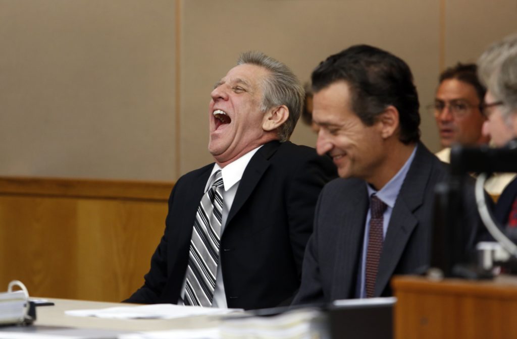 Steven Mark Chaney reacts to his release during a hearing in a Dallas courtroom where a court reversed his 1987 murder conviction because of discredited bite mark testimony. Photographed on Monday, October 12, 2015. Innocence Project Attorneys M. Chris Fabricant and Barry Cshack are on the right. (Photo copyright Lara Solt)