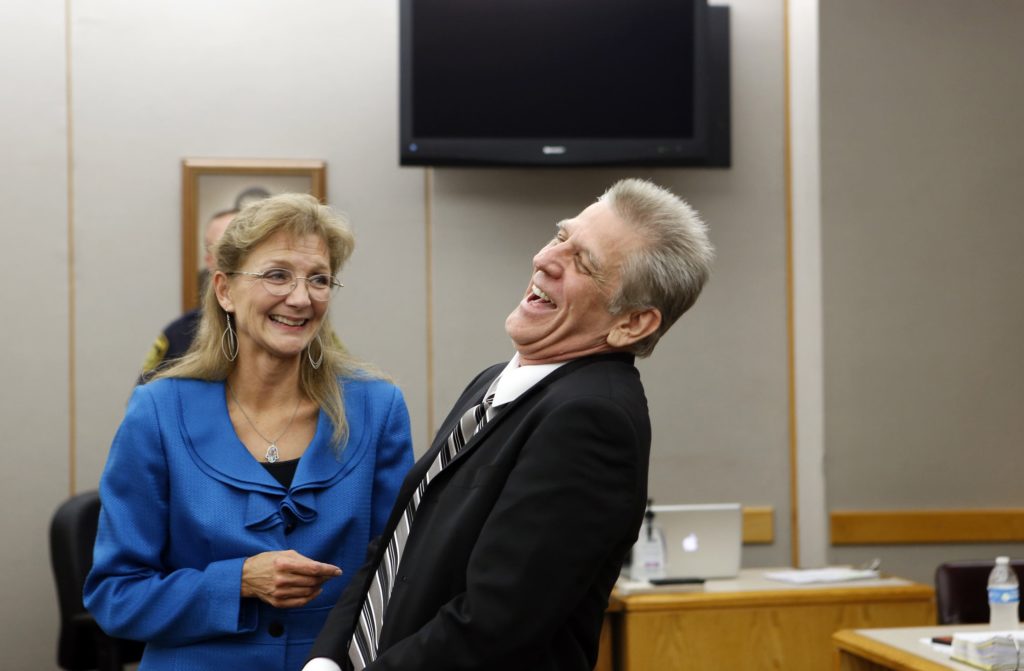 Steven Mark Chaney reacts to his release during a hearing in a Dallas courtroom where a court reversed his 1987 murder conviction because of discredited bite mark testimony. Photographed on Monday, October 12, 2015. Dallas Public Defenders Exoneration Attorney Julie Lesser is on the left. (Photo copyright Lara Solt)